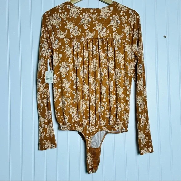 FREE PEOPLE Turnt Surplice Bodysuit in a copper floral print Medium NWT - Picture 10 of 11